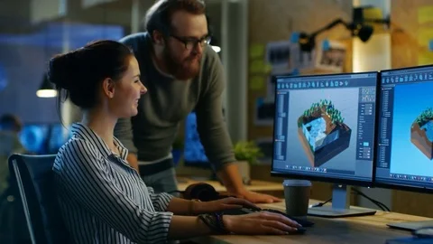 Female Game Developer Has Discussion with Male Project Manager While Working. Stock Footage 79389126