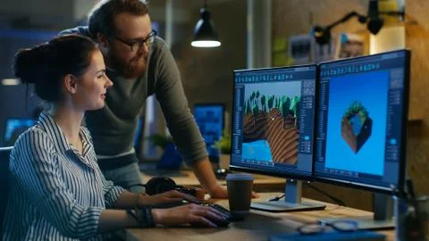 Female Game Developer Has Discussion with Male Project Manager While Working  Stock Photos
