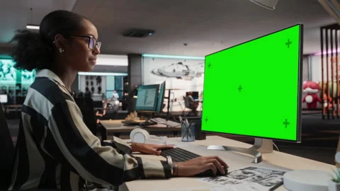 Female Game Developer Using Chromakey Computer In Office Stock Footage 255795545