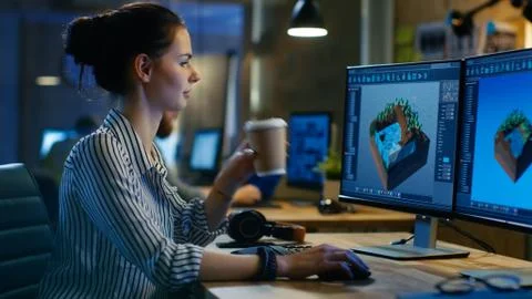 Female Game Developer Works on a Level Design on Her Personal Computer with T Stock Photos