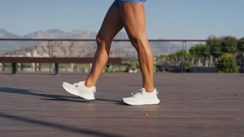 Female gets up and gets ready to run in the morning at dawn. Close up of young Stock Footage 247397729
