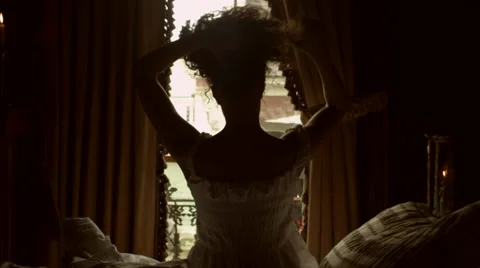 Female Gets Dressed At Bedside Stock Footage 62837374