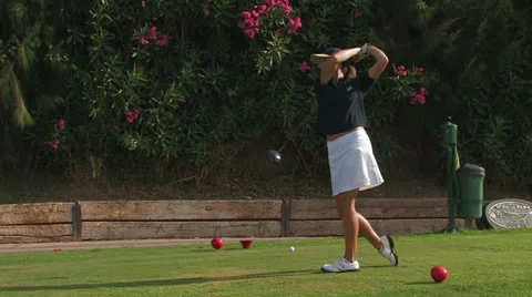 Female golfer tees off Stock Footage