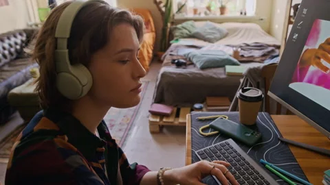 Female Graphic Designer Working on Computer and Eating French Fries at Home Desk Stock Footage 334802722