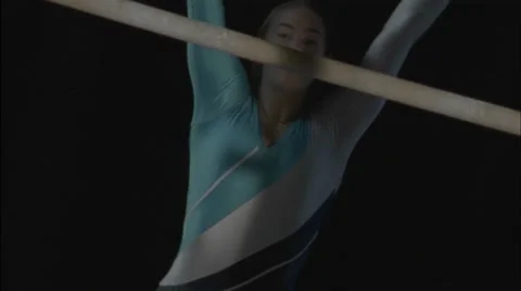 A female gymnast performs on parallel bars. Video stock 4928404