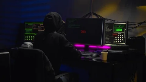 Female hacker in dark room using computer virus program for cyber attack Video stock 125073161
