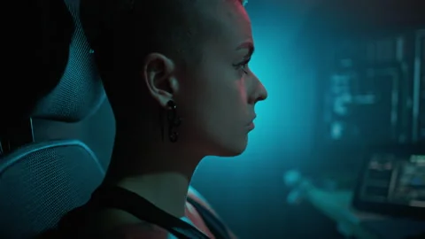 Female hacker observes server deciphering process in office Stock Footage 257810620