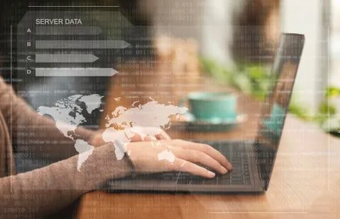 Female hacker using laptop looking at database server Stock Photos