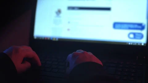 Female Hacker Using Laptop Over the Shoulder 3.1 Stock Footage 154262589