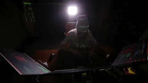 Female hacker working on a computer, coding at night Stock Footage 69794980