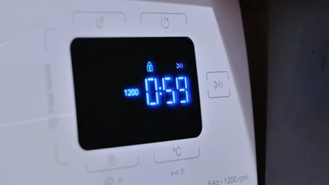 Female Hand Activating Washing Machine With LED Display and Blue Countdown Timer Stock Footage 306920543