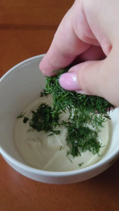 Female Hand Adding Dill to Sour Cream Sauce, Close Shot Stock Footage 338188736