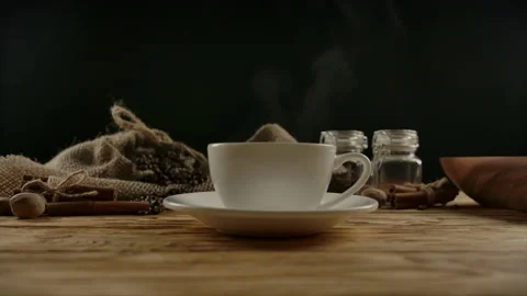 Female hand adding white sugar into coffee or tea cup and mixing up by spoon Stock Footage 138522147