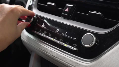 Female hand adjusting the car climate control Stock Footage 344307965