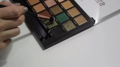 Female hand with brush. Professional multicolored makeup eyeshadow palette Video stock 274242560