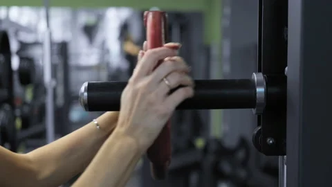Female hand changes weight of barbell in gym. Sport concept. Stock Footage 201248242