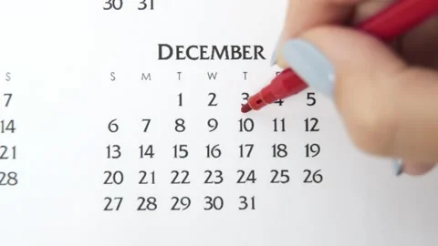 Female hand circle day in calendar date with a red marker. Business Basics Wall Stock Footage