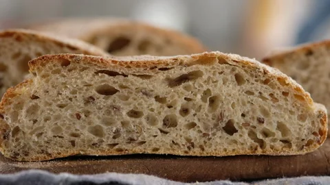 Female hand clicks on bread and it returns to its original state. Sliced bread Video stock 145492205