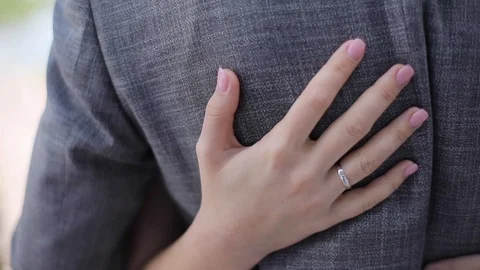 Female hand close up stroking caressing man back slow motion shallow dof  Stock Footage 90927352