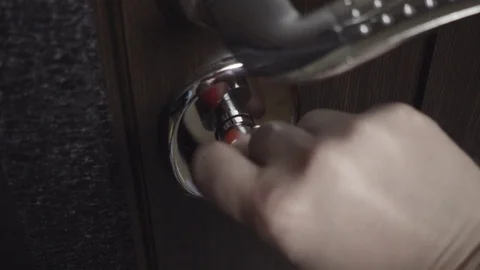 Female hand closes the lock on the door Stock Footage 73006281