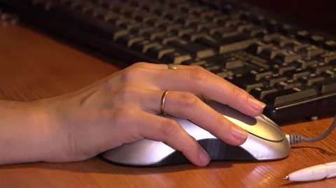 Female hand on computer mouse. 4K. Stock Footage 44150039