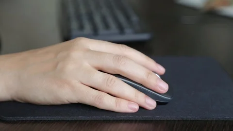 Female hand on computer mouse Stock Footage 95988379