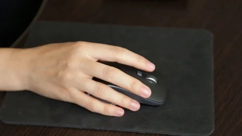 Female hand on a computer mouse Stock Footage 121765672