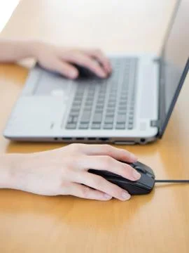 Female hand with computer mouse on table, closeup Foto stock