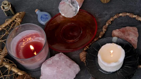 Female hand with crystal glass ball, pendulum swings over astrologer's tabl.. Stock Footage 270146053