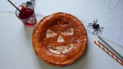 Female hand decorating table with delicious homemade pie for halloween Stock Footage 154864565