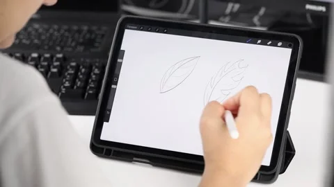 Female hand draws on a tablet Video stock 220305103