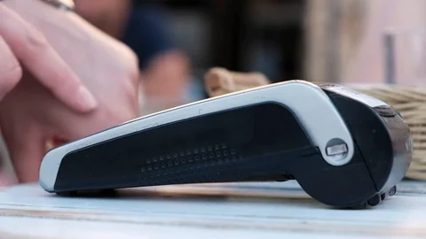 Female hand entering pin code on wireless terminal Stock Footage 91181332