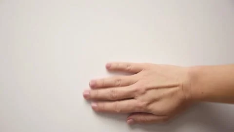 Female hand erases something from the wall Video stock 144663165