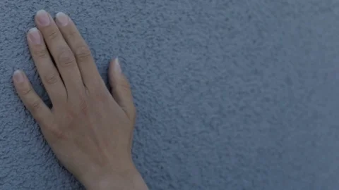 Female hand gently strokes the texture wall Stock Footage 76278335