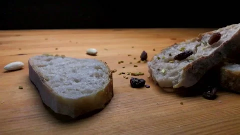 Female hand grabbing a slice of bread in slow motion Stock Footage 131116362