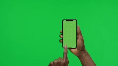 Female Hand holding Green Screen Smartphone and Scrolling Up Stock Footage