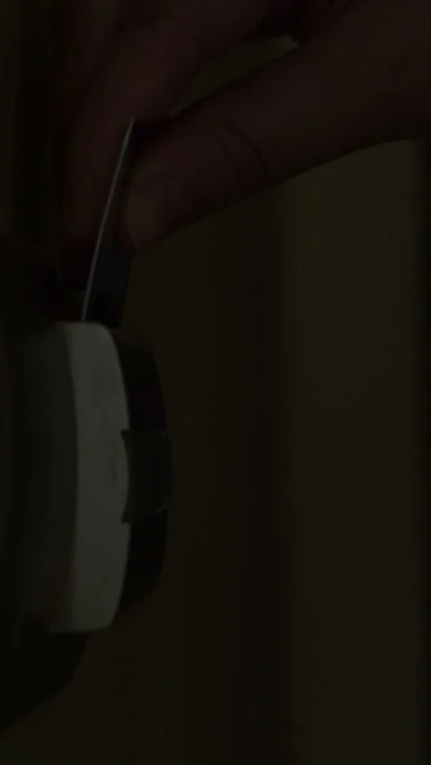 Female hand inserting a key card into a hotel room's electronic lock to Stock Footage 342904125