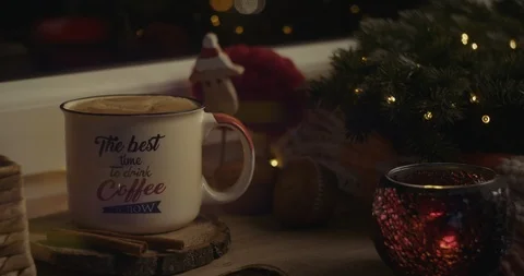 Female hand inserting a straw in a beverage in a cozy Christmas atmosphere. Stock Footage 120026571
