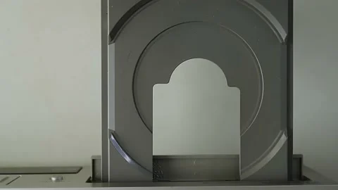 Female hand inserts DVD into video player. Opens the CD player tray. Stock Footage 201322949