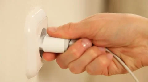 Female hand inserts a plug into a socket and removes it Stock Footage 61268967