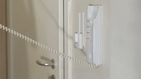 Female hand with intercom on wall. Stock Footage 232959297
