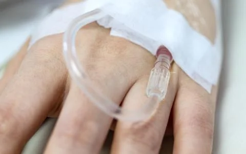 Female hand with iv solution 스톡 사진