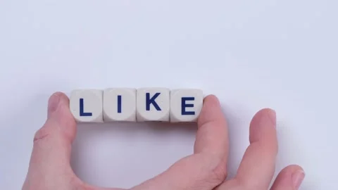 Female hand lays text like from cubes with letters on a white background Stock Footage 218306760