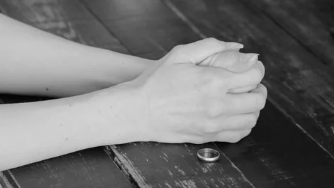 Female Hand Leaving Wedding Ring On Table. Divorce Stock Footage 129294157