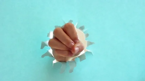 Female hand makes a countdown on background of blue torn paper. Stock Footage 124521920