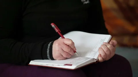 Female hand making notes in a notebook Stock Footage 49409815