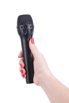 Female hand with a microphone. Stock Photos