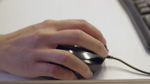 A female hand moves a computer mouse on the desk Stock Footage 163029810