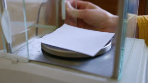 The female hand opens the door of analytical high-precision scales. Indoors, clo Stock Footage 85612939