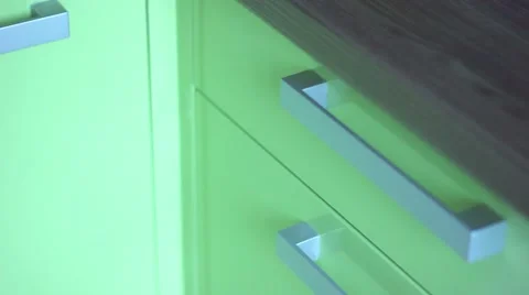 Female hand opens a silverware drawer and takes two forks Stock Footage 50944342